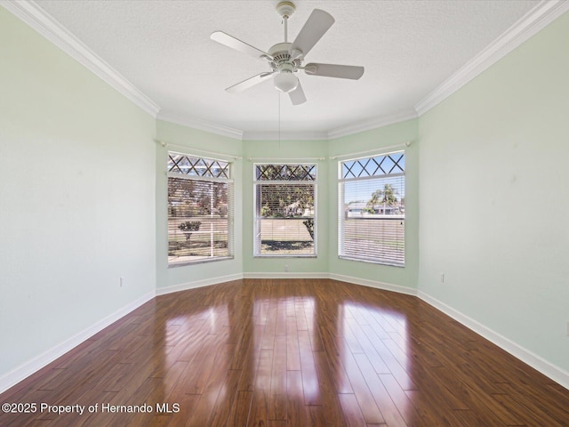 empty room with baseboards, a textured ceiling, a ceiling fan, and wood finished floors