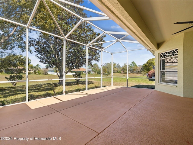 view of patio with glass enclosure