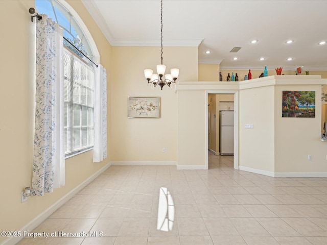 empty room featuring light tile patterned floors, a notable chandelier, crown molding, and visible vents