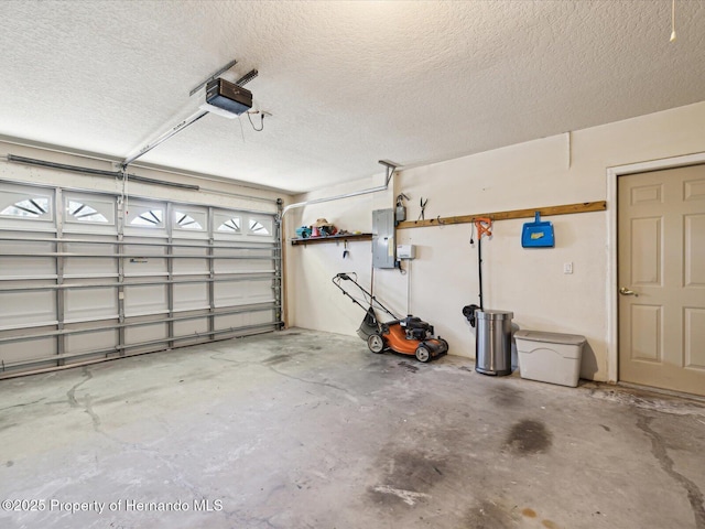 garage featuring electric panel and a garage door opener