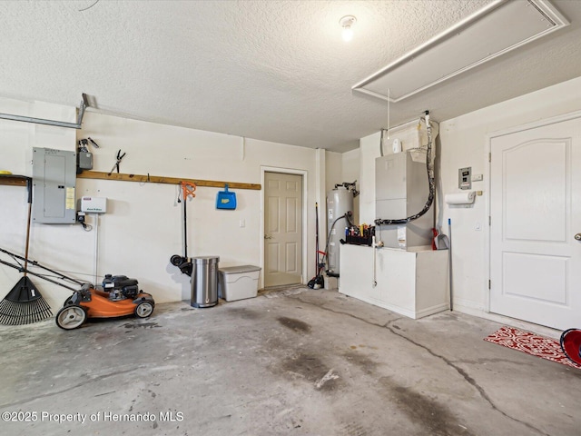 garage featuring heating unit, gas water heater, and electric panel