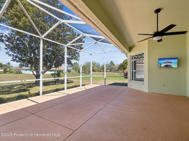 view of patio with a lanai and ceiling fan