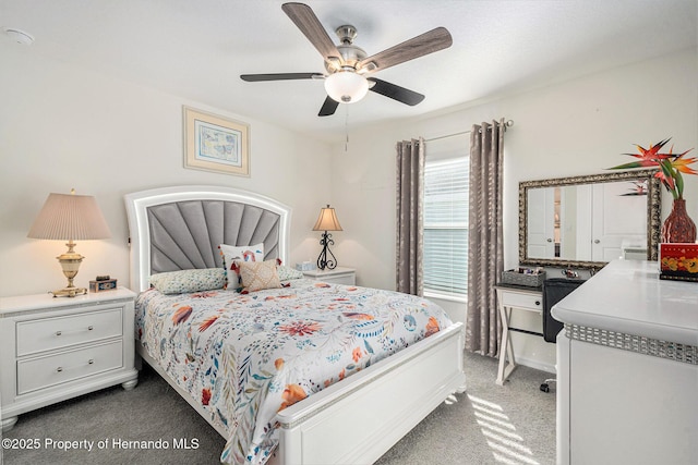 bedroom with carpet and a ceiling fan