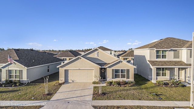 view of front of property featuring a residential view, stucco siding, concrete driveway, and a garage