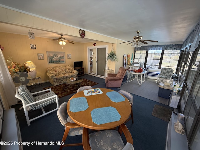 dining area featuring a ceiling fan and carpet floors