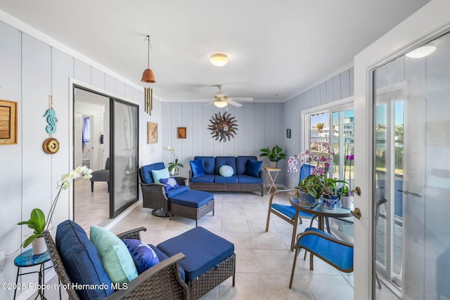 living room with light tile patterned floors and ceiling fan