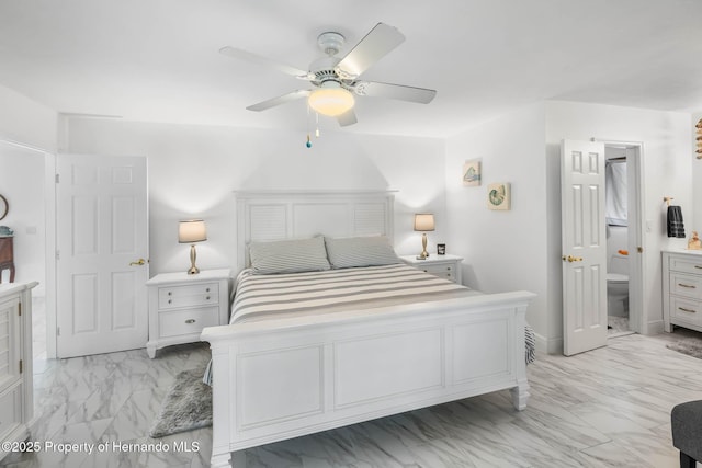 bedroom with marble finish floor and ceiling fan