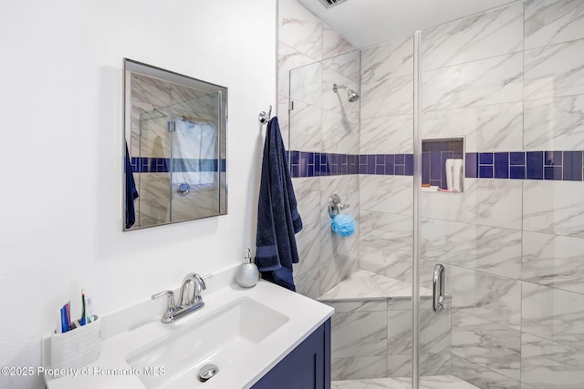 full bath featuring visible vents, a shower stall, and vanity