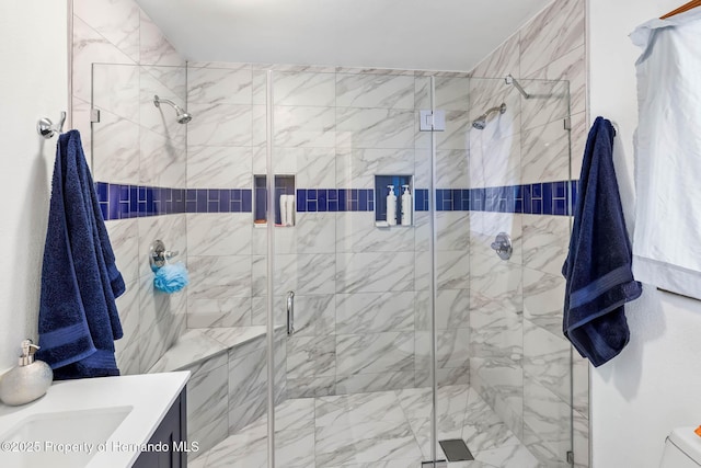 bathroom featuring vanity and a stall shower