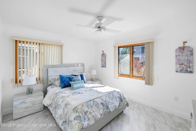 bedroom with marble finish floor, baseboards, and ceiling fan