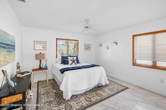 bedroom with baseboards, marble finish floor, and ceiling fan