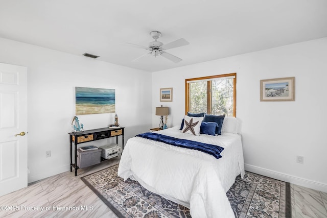 bedroom with visible vents, a ceiling fan, and baseboards