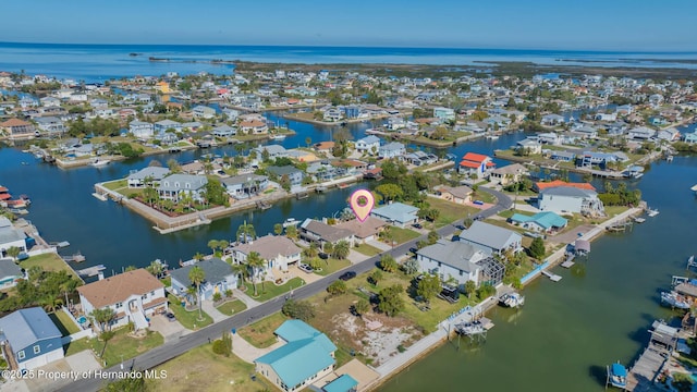 bird's eye view featuring a water view and a residential view