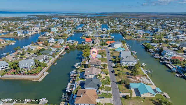 aerial view with a residential view and a water view