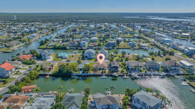 aerial view with a residential view and a water view