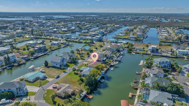 birds eye view of property featuring a residential view and a water view