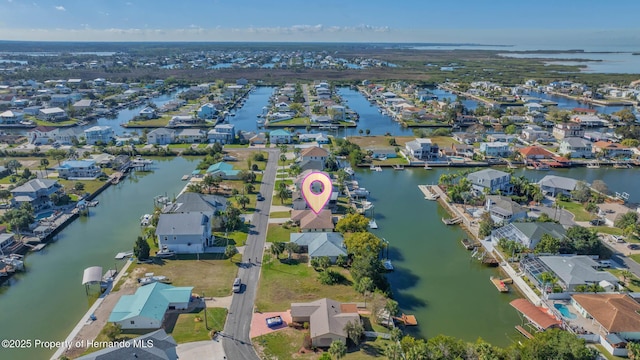 aerial view with a residential view and a water view