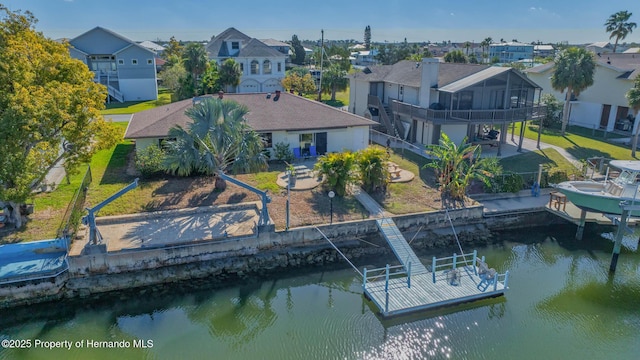 bird's eye view with a residential view and a water view