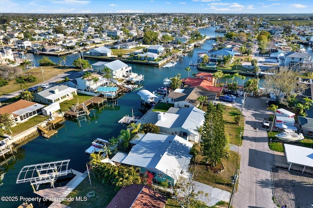 bird's eye view with a residential view and a water view