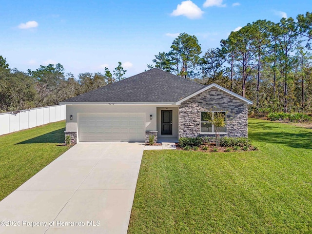 single story home featuring fence, a front yard, driveway, stone siding, and an attached garage