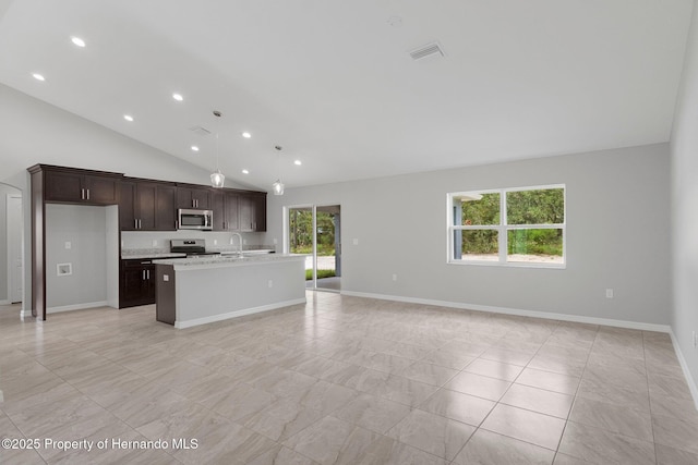 kitchen with stainless steel appliances, visible vents, open floor plan, and light countertops