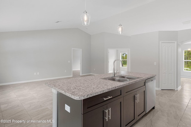 kitchen with lofted ceiling, a sink, light countertops, dishwasher, and decorative light fixtures