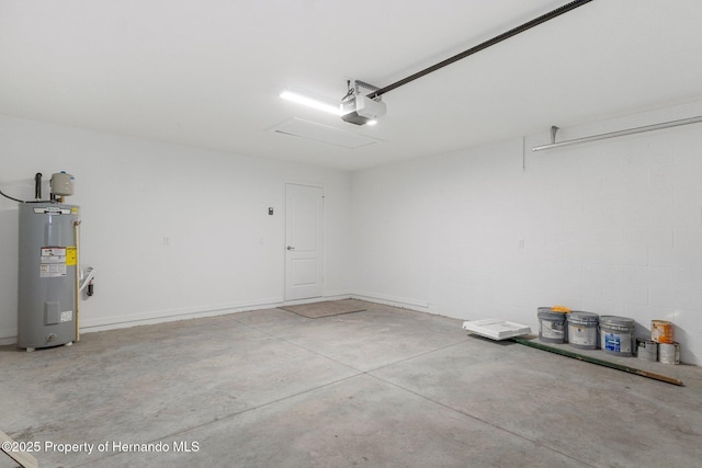 garage featuring a garage door opener and water heater