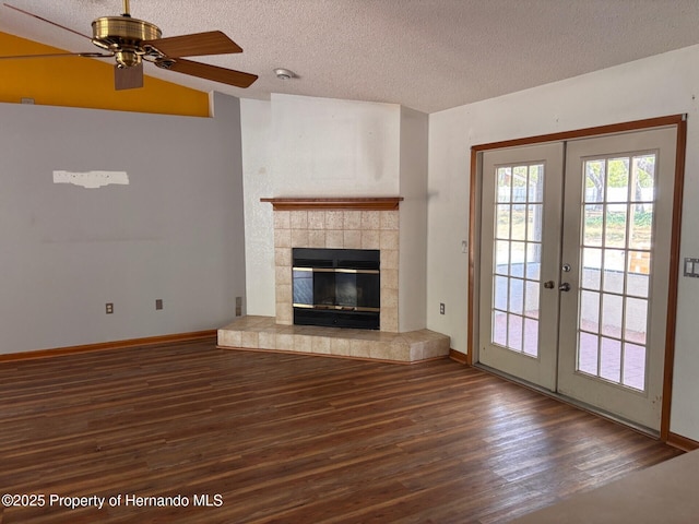 13935 Linden Dr, Spring Hill, FL 34609 - unfurnished living room featuring french doors, a ceiling fan, a textured ceiling, wood finished floors, and baseboards