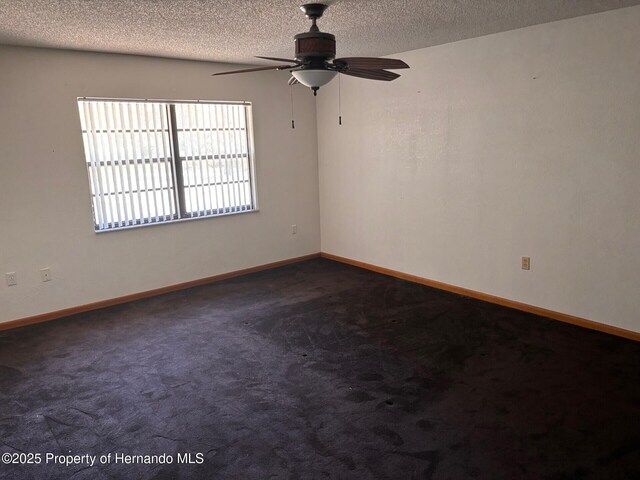 13935 Linden Dr, Spring Hill, FL 34609 - unfurnished room featuring dark colored carpet, a ceiling fan, a textured ceiling, and baseboards