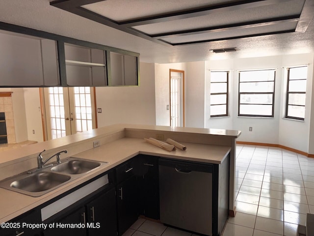 13935 Linden Dr, Spring Hill, FL 34609 - kitchen with visible vents, dishwasher, a sink, light tile patterned floors, and light countertops