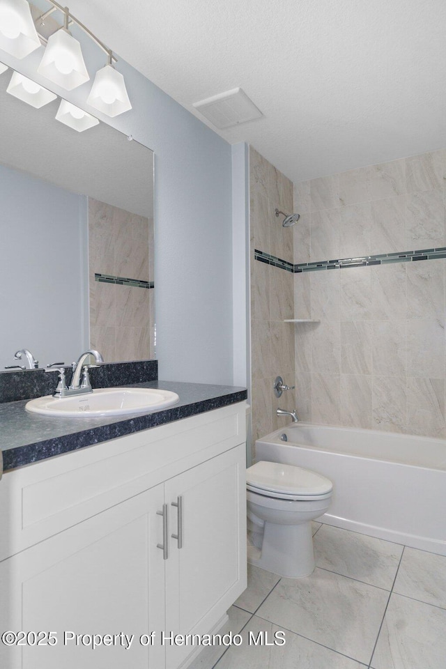 full bathroom featuring vanity, toilet, washtub / shower combination, and visible vents