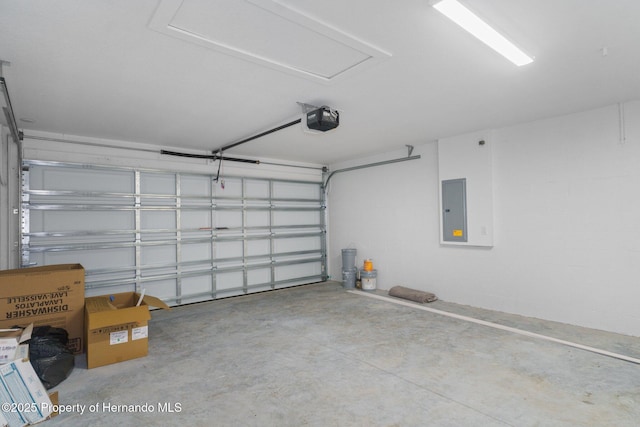 garage featuring electric panel and a garage door opener