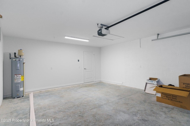 garage featuring a garage door opener and electric water heater