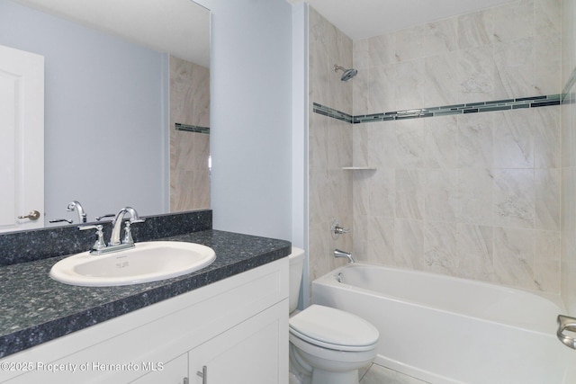 full bathroom featuring vanity, toilet, and washtub / shower combination