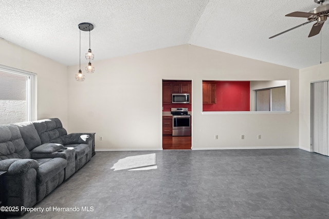 unfurnished living room featuring baseboards, a textured ceiling, ceiling fan, and vaulted ceiling