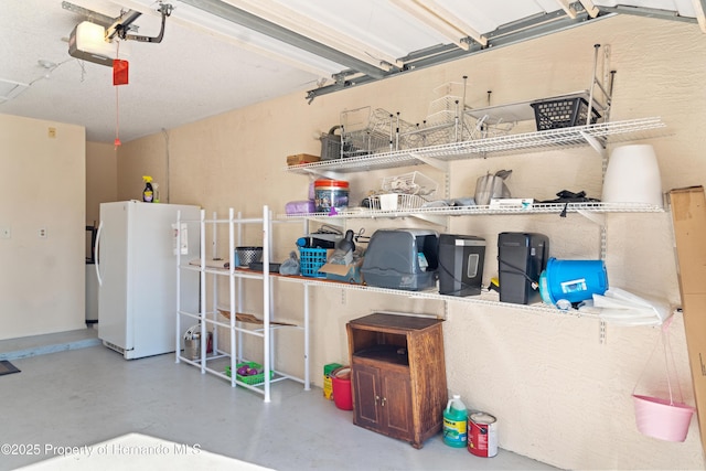 garage with freestanding refrigerator