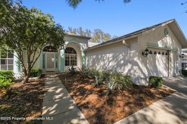 view of front of home with a garage