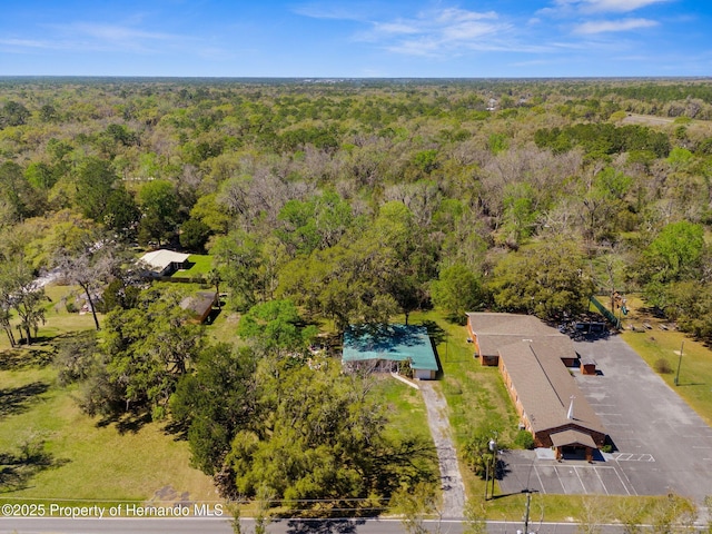 drone / aerial view with a view of trees