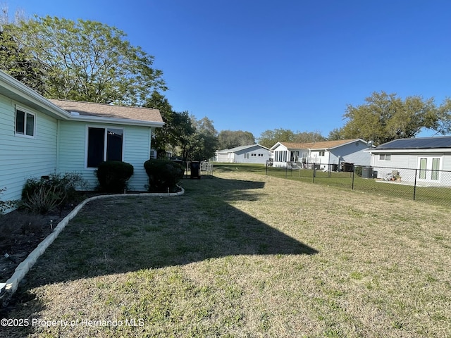 view of yard with a residential view and a fenced backyard