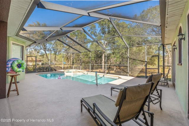 outdoor pool featuring a lanai and a patio area