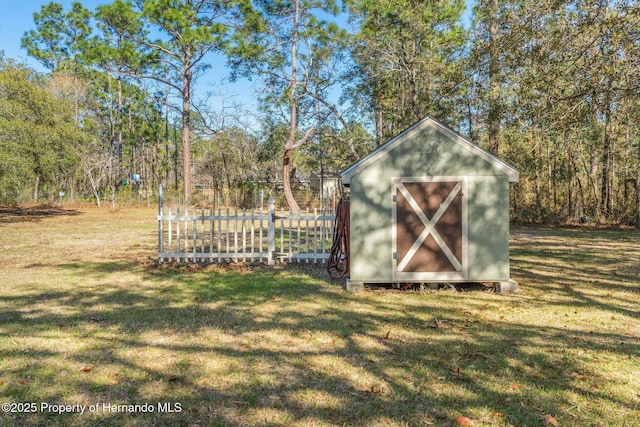 view of shed with fence