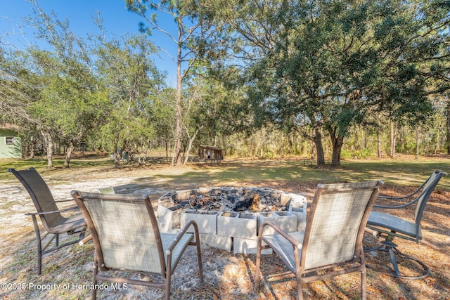 view of patio / terrace with an outdoor fire pit