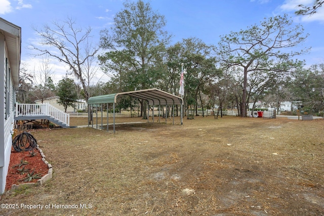 view of yard featuring a carport
