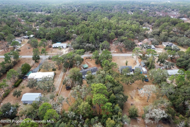 drone / aerial view with a view of trees