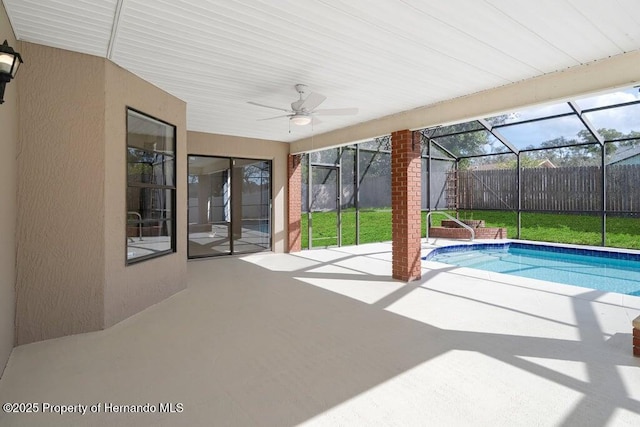 11080 Marquette St, Spring Hill, FL 34609 - outdoor pool featuring a ceiling fan, a lawn, a patio area, fence, and a lanai