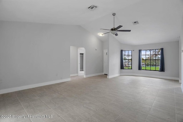 11080 Marquette St, Spring Hill, FL 34609 - unfurnished living room with arched walkways, visible vents, baseboards, and ceiling fan