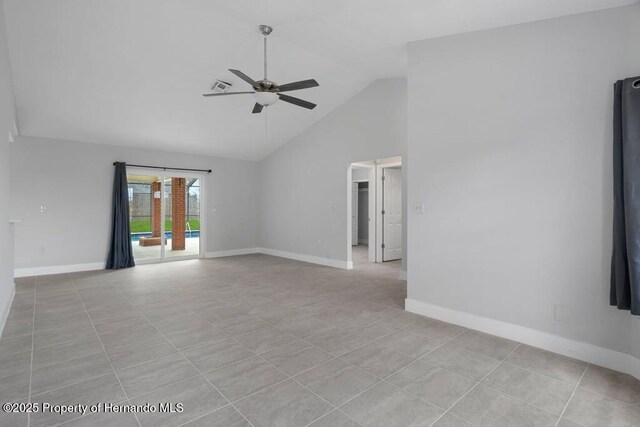 11080 Marquette St, Spring Hill, FL 34609 - spare room with visible vents, light tile patterned floors, baseboards, a ceiling fan, and high vaulted ceiling