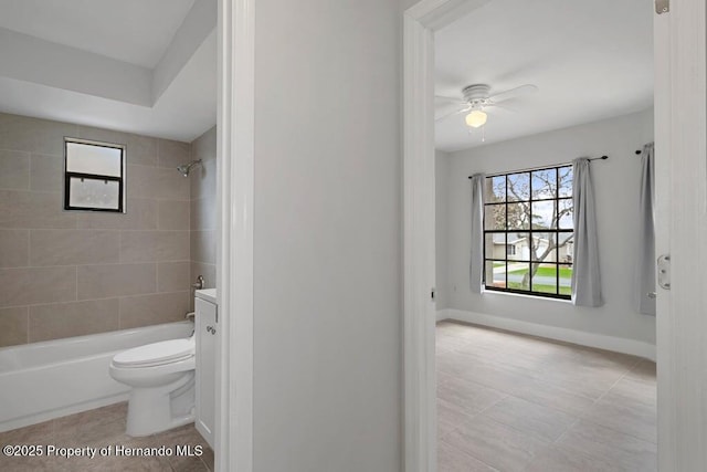 11080 Marquette St, Spring Hill, FL 34609 - full bath with baseboards, tile patterned floors, toilet, bathtub / shower combination, and ceiling fan