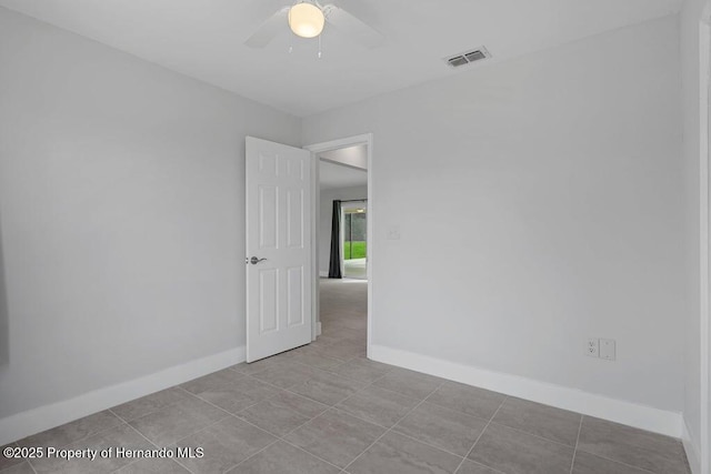 11080 Marquette St, Spring Hill, FL 34609 - empty room featuring tile patterned flooring, visible vents, baseboards, and ceiling fan