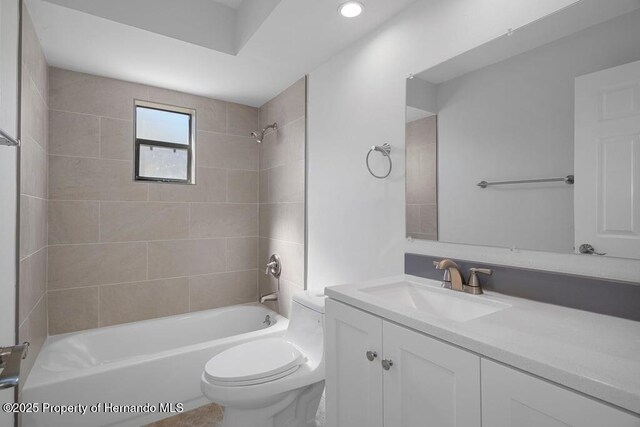11080 Marquette St, Spring Hill, FL 34609 - full bath featuring toilet, vanity, shower / bathtub combination, and recessed lighting
